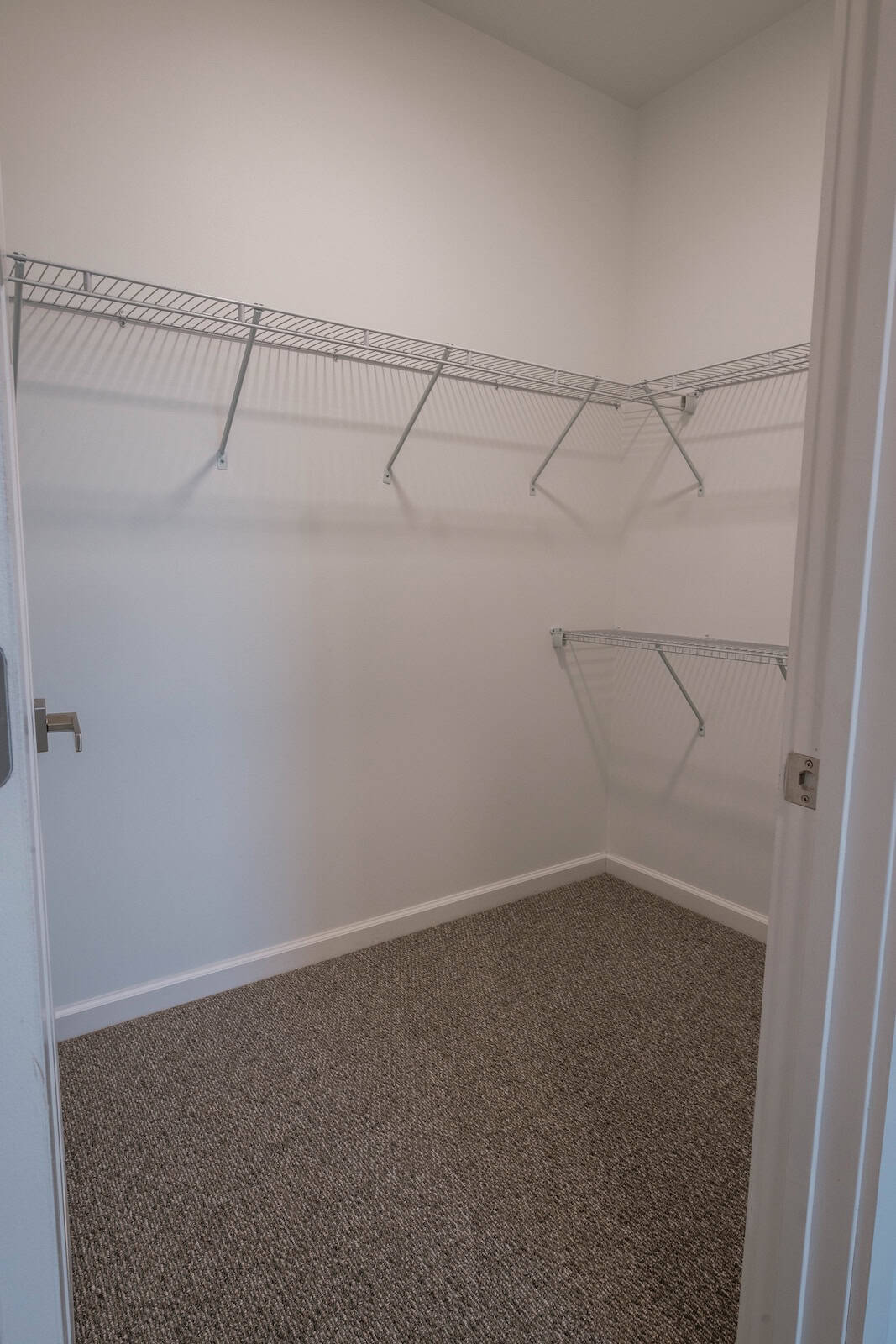 Closet with wire shelving in a modern apartment at The Pearl, Minneapolis, MN.