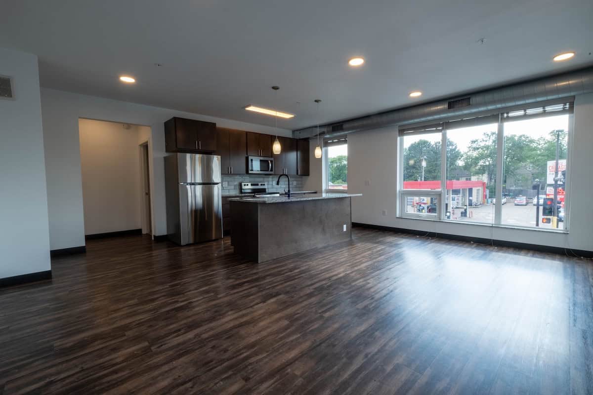 Spacious apartment with kitchen and large window view in Minneapolis.