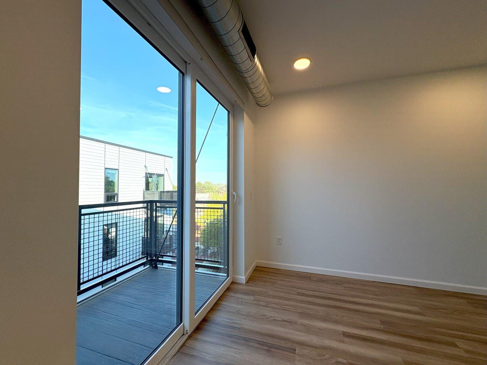 Modern apartment with balcony and large windows in Minneapolis, Minnesota.